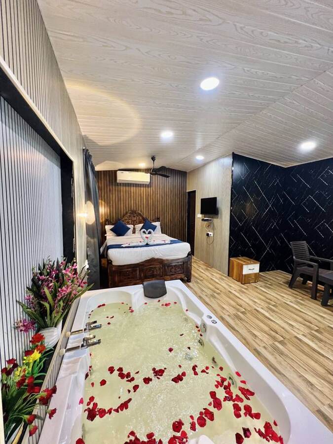 Bathtub beside the bed